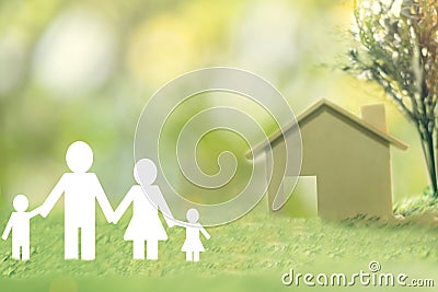 Happy Family paper on green grass see the house for saving money sale. Stock Photo