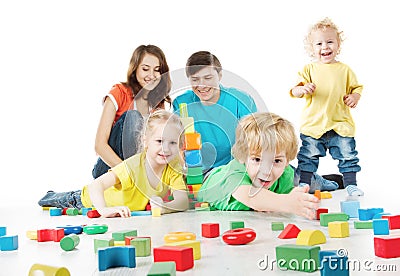 Happy family. Parents with three kids playing toys blocks Stock Photo