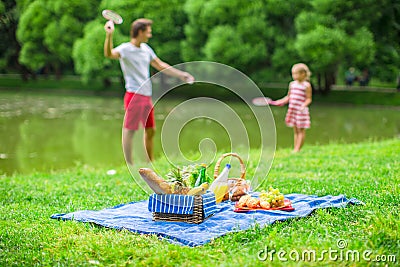 Happy family picnicking in the park Stock Photo