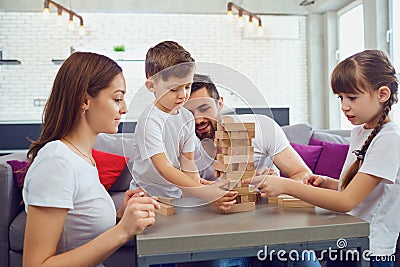 Happy family playing board games at home. Stock Photo