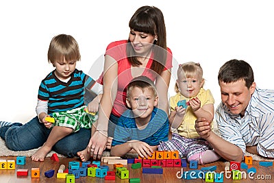 Happy family are playing on the floor Stock Photo