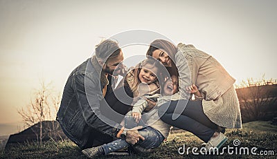 Happy family playing outdoor. Family enjoying together in nature Stock Photo