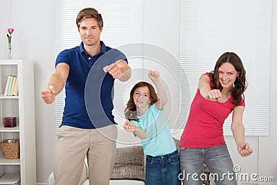 Happy family playing videogame Stock Photo