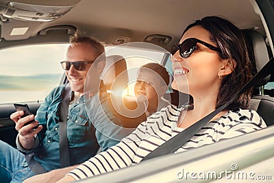 Happy family riding in a car Stock Photo