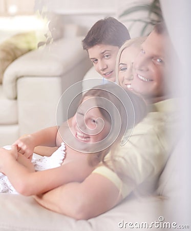 Happy family smiling and looking Stock Photo