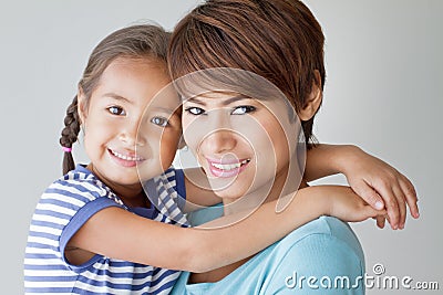 Happy family with smiling, positive daughter and mother Stock Photo