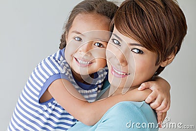 Happy family with smiling, positive daughter and mother Stock Photo