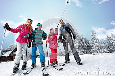 Family sport skiing and snowboarding time on sunny day Stock Photo