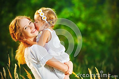 Happy family on summer. little girl child baby daughter hugging Stock Photo