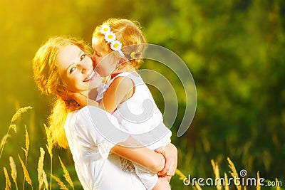 Happy family on summer. little girl child baby daughter hugging Stock Photo