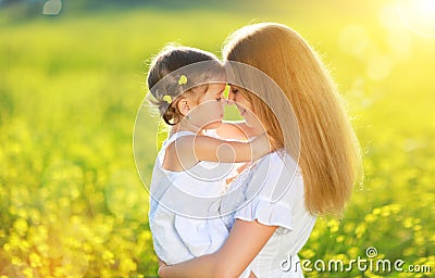 Happy family on summer. little girl child baby daughter hugging Stock Photo