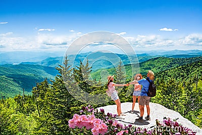 Happy family on summer trip in the mountains. Stock Photo