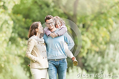 Happy family of three having fun outdoor. Stock Photo