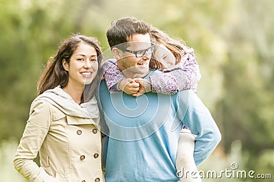 Happy family of three having fun outdoor. Stock Photo