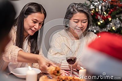 Happy family time and relationship, Asian big family having small party eating food at home. Grandparent is happy to see his child Stock Photo