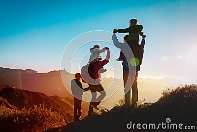 Happy family travel in mountains at sunset Stock Photo