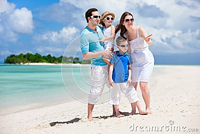 Happy family on tropical vacation Stock Photo