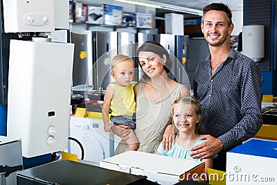 Happy family with two children shopping Stock Photo