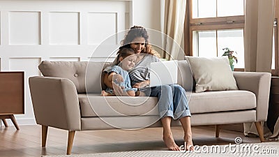 Happy family of two watching comedy movie cartoons on laptop. Stock Photo