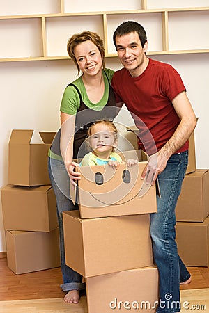 Happy family unpacking in a new home Stock Photo