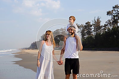 Happy family on vacation, mom, dad, son. baby on daddy`s shoulders Stock Photo