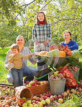 Happy family with vegetables harvest Stock Photo