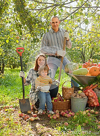 Happy family with vegetables harvest Stock Photo