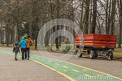 Happy family walking in the park in wintertime Editorial Stock Photo