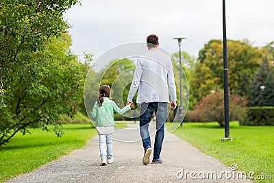 Happy family walking in summer park Stock Photo