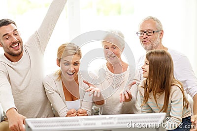 Happy family watching tv at home Stock Photo