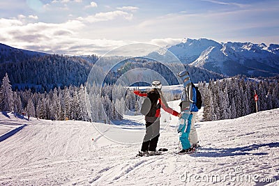 Happy family in winter clothing at the ski resort Stock Photo