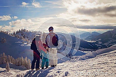 Happy family in winter clothing at the ski resort Stock Photo