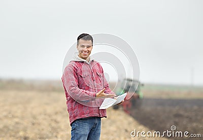 Happy farmer on the field Stock Photo