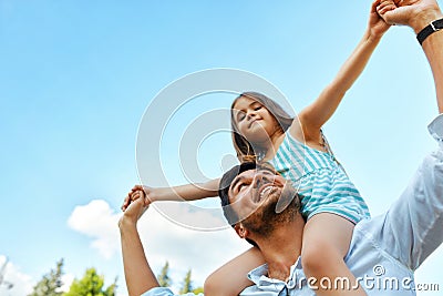 Happy Father And Child Having Fun Playing Outdoors. Family Time Stock Photo