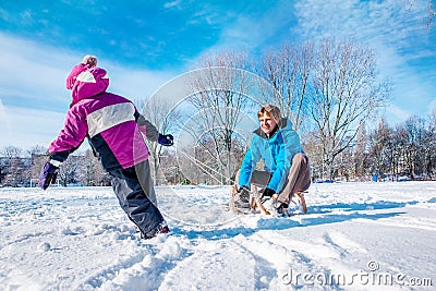 Happy father and kid with sledges Stock Photo