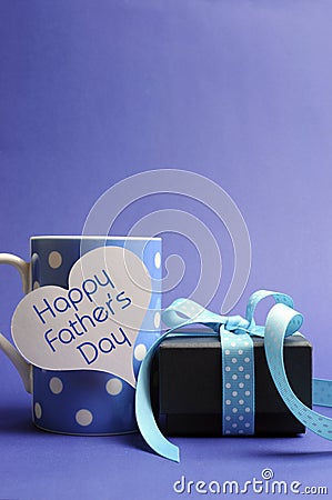 Happy Father's Day blue polka dot coffee mug & gift - vertical with copyspace Stock Photo