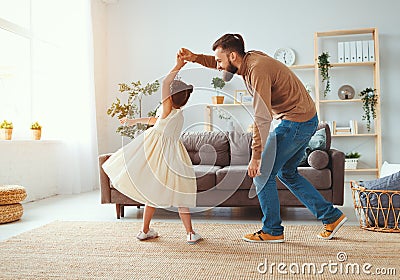 Happy father`s day! family dad and child daughter Princess dancing Stock Photo