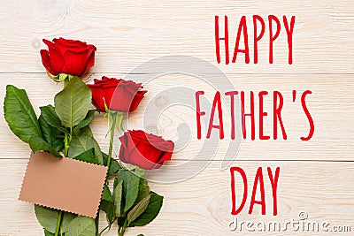 Happy father`s day, 3 red roses with empty craft paper card Stock Photo