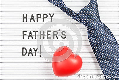 Happy father`s day text on letter board and tie with heart Stock Photo