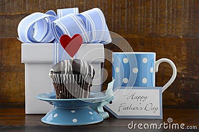 Happy Fathers Concept with blue and white gift and cupcake. Stock Photo