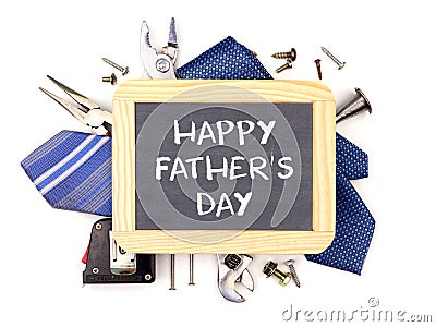 Happy Fathers Day chalkboard with underlying frame of tools and ties isolated on white Stock Photo