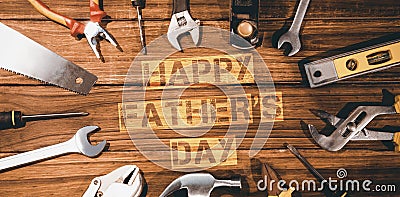 Happy fathers day message surrounded by tools Stock Photo