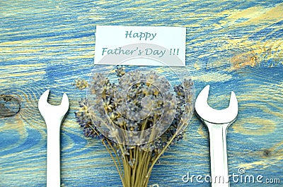 Happy fathers day wishes, bunch of gorgeous lavender flowers and spanners Stock Photo