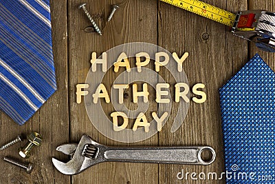 Happy Fathers Day on wood with tools and ties Stock Photo