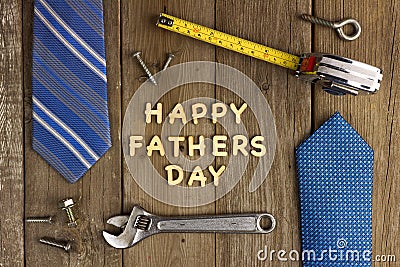 Happy Fathers Day on wood with tools and ties Stock Photo