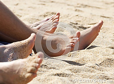 Happy feet on sand beach Stock Photo