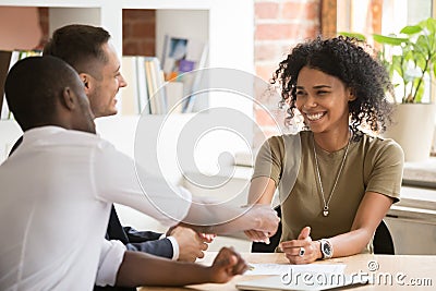 Happy female african vacancy candidate shaking hand of hr manager Stock Photo