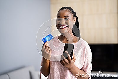 Happy Female Doing Phone Payment Stock Photo