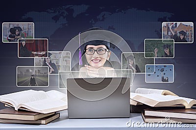 Happy female graduate and digital photos Stock Photo