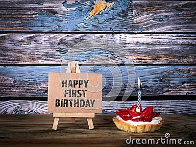 Happy First Birthday. Cake with candle Stock Photo